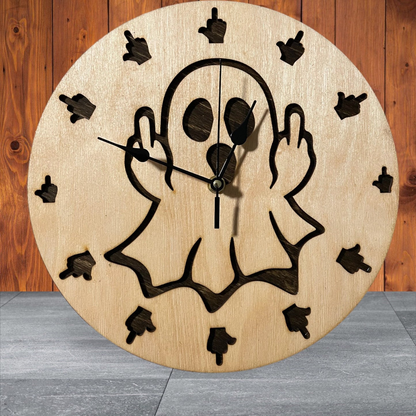 Wall Clock with ghost giving the middle finger on a wood background