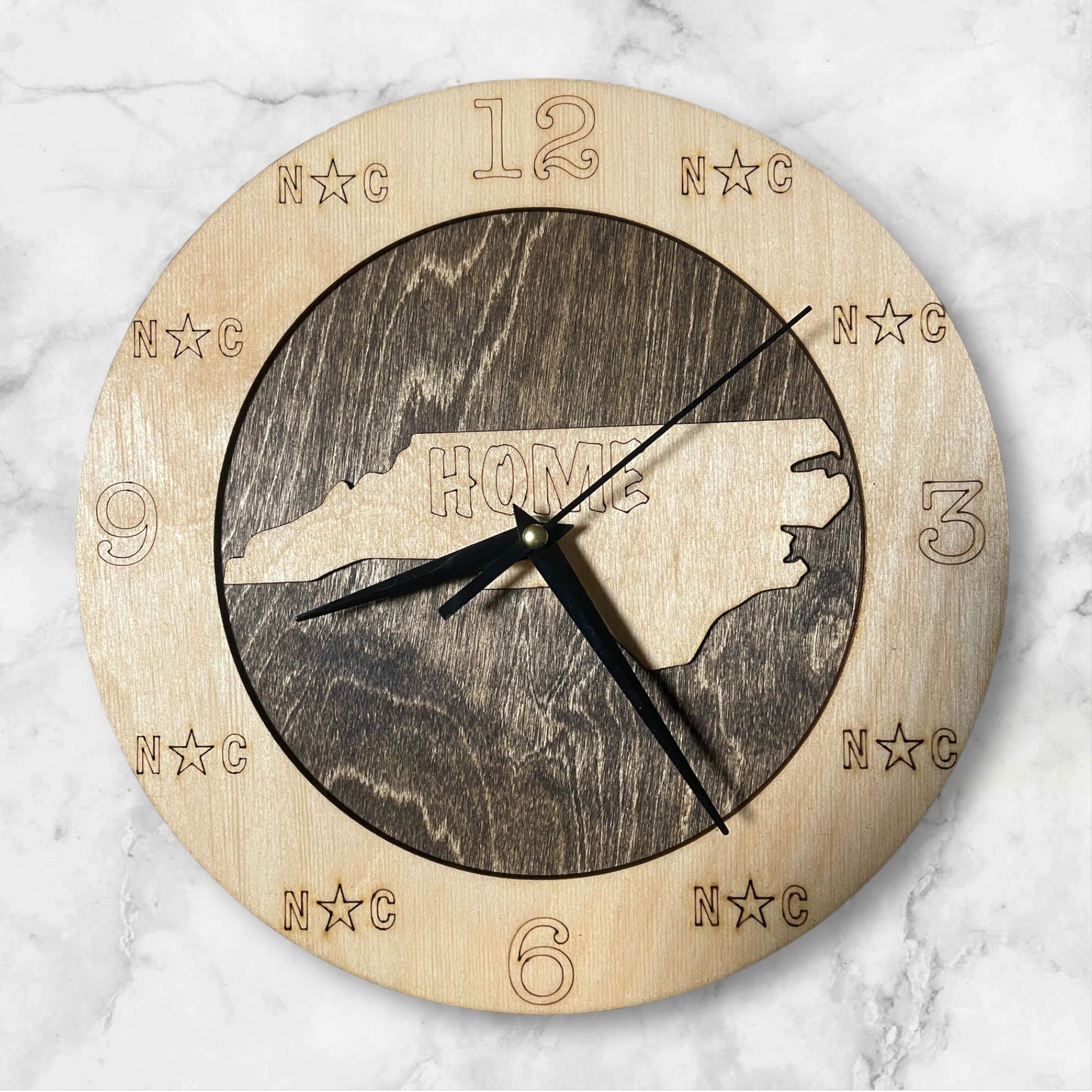 North Carolina Wall Clock on marble background